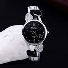Women's British Diamond Watch featuring a sleek black dial and heart-shaped accents for a stylish look.