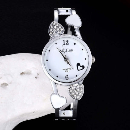 Women's British Diamond Watch featuring a quartz movement and decorative heart accents.