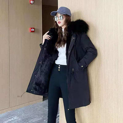Womens Cashmere Coat With Detachable Liner displayed on a model wearing stylish accessories and standing indoors.