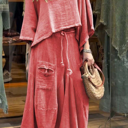 Womens Casual Loose Long Sleeve Top And Skirt Set in coral color, displayed in a storefront, featuring a relaxed fit.