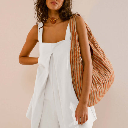 Womens Casual Solid Color Short Jumpsuit Romper featuring a model with a stylish bag.