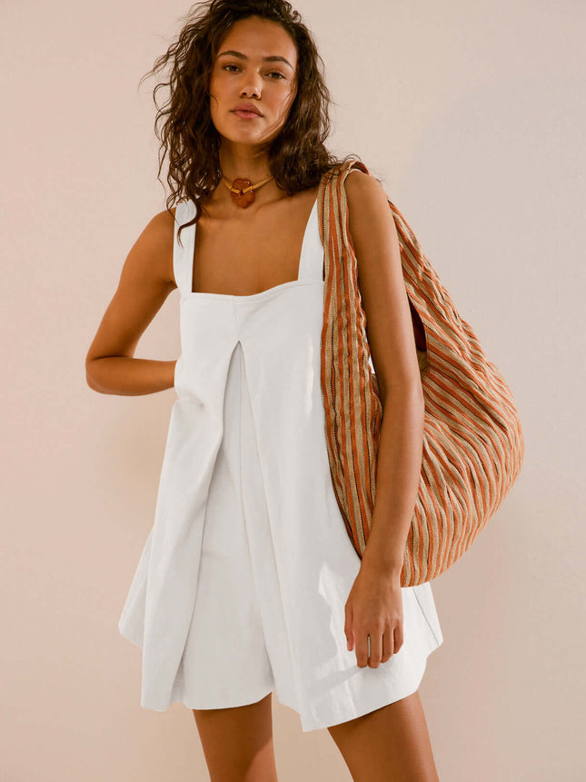 Womens Casual Solid Color Short Jumpsuit Romper featuring a model with a stylish bag.