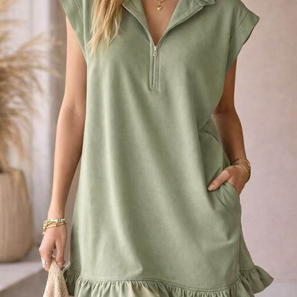 Womens Casual V Neck Ruffle Sleeveless Pocket Dress in green with ruffle hem and zip collar, model wearing dress with pocket.