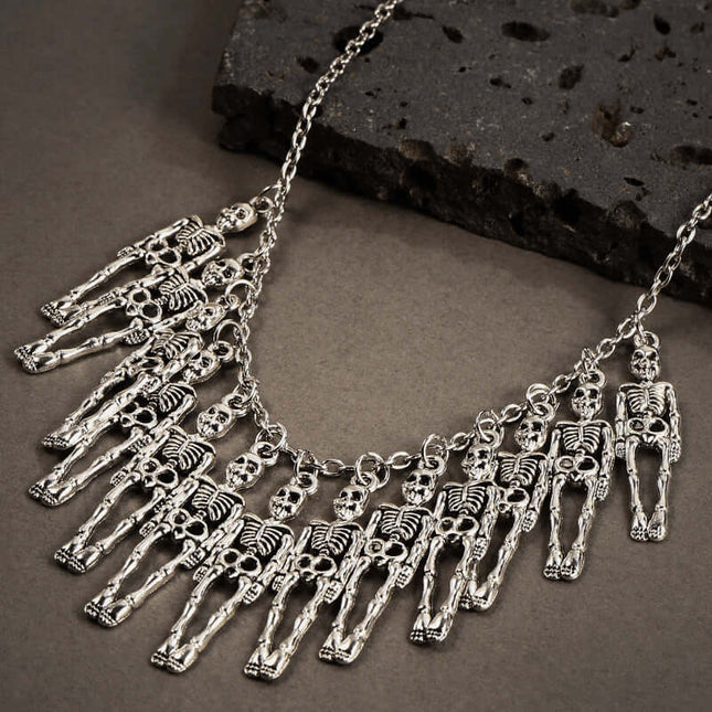 Womens Dark Gothic Skeleton Hand Necklace Earrings Set featuring a unique skeleton design with metallic details.