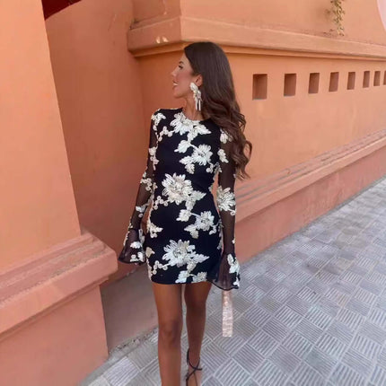Womens Floral Bell Sleeve Mesh Mini Party Dress on model outdoors, showcasing beautiful floral design and stylish sleeves.