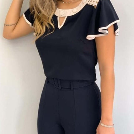 Womens Flutter Sleeve Round Neck Top worn by a model, featuring a stylish dark design with ruffled sleeves.