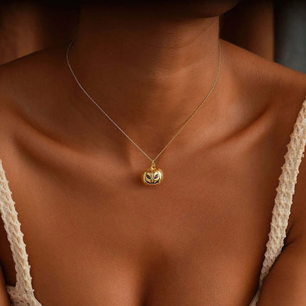 Womens Gold Pumpkin Diamond Halloween Necklace worn elegantly, showcasing the intricate pumpkin design on a delicate gold chain.