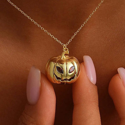 Womens Gold Pumpkin Diamond Halloween Necklace featuring a gold pumpkin pendant with intricate detailing.