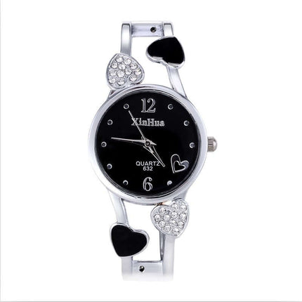 Women's British Diamond Watch with heart accents and black dial, elegant quartz timepiece.