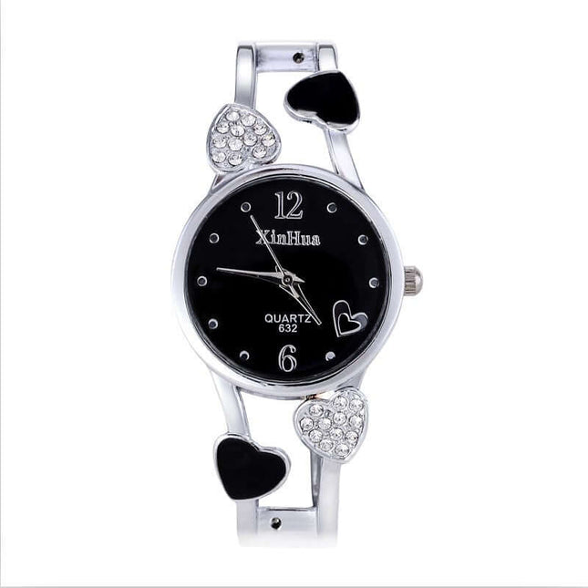 Women's British Diamond Watch with heart accents and black dial, elegant quartz timepiece.