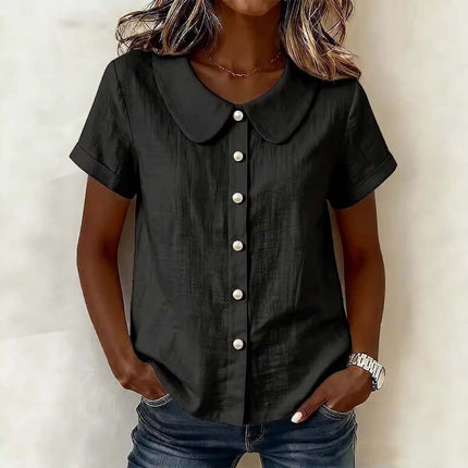 Womens Solid Colored Short Sleeve Casual Shirt in black with button details and rounded collar, paired with casual jeans.