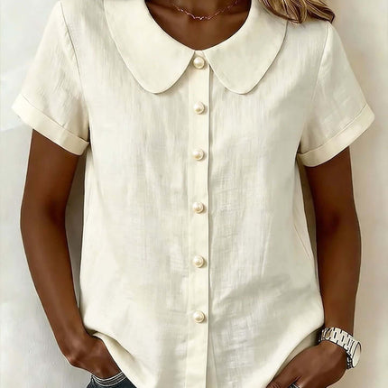 Womens Solid Colored Short Sleeve Casual Shirt in cream color with button details and a collar.