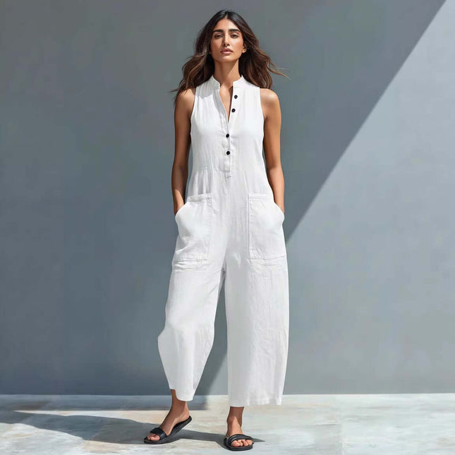 Womens Summer Sleeveless V Neck Pocket Jumpsuit displayed on a model in a white jumpsuit with pockets.