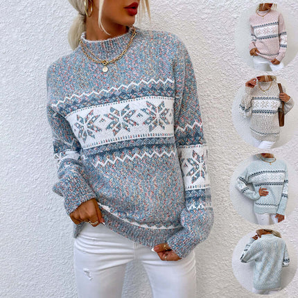 Women's Winter Snowflake Half Turtleneck Sweater in blue with snowflake pattern, styled with white pants.