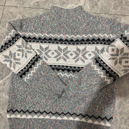 Back view of Women's Winter Snowflake Half Turtleneck Sweater showcasing intricate snowflake pattern.