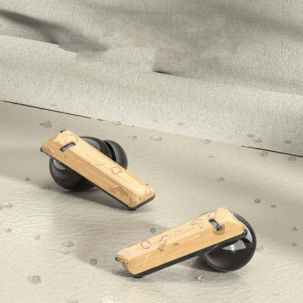Wood Grain Wireless Sports Noise Cancel Headphones resting on a textured surface with a stylish design.