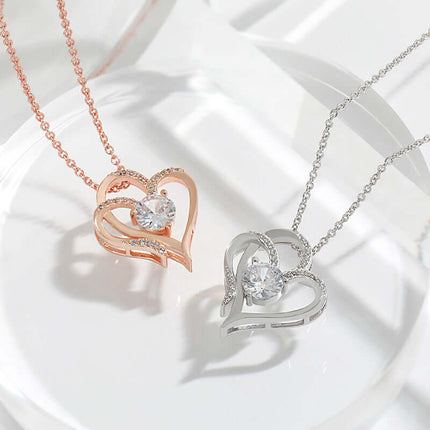 Zircon Double Love Heart Necklace Rhinestone Jewelry displayed in rose gold and silver on a clear surface.